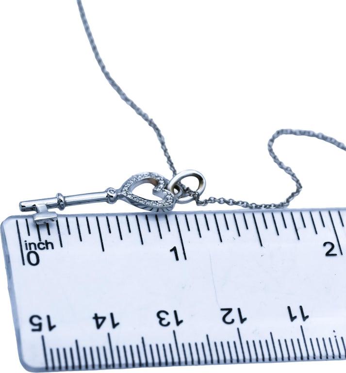 TIFFANY & CO. 18k White Gold VS Round Diamond Heart Key Pendant Necklace 0.12CT