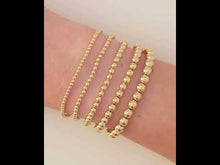 Load and play video in Gallery viewer, 14K Yellow Gold-Filled 6 mm Elastic Bead 6 1/2&quot; Bracelet
