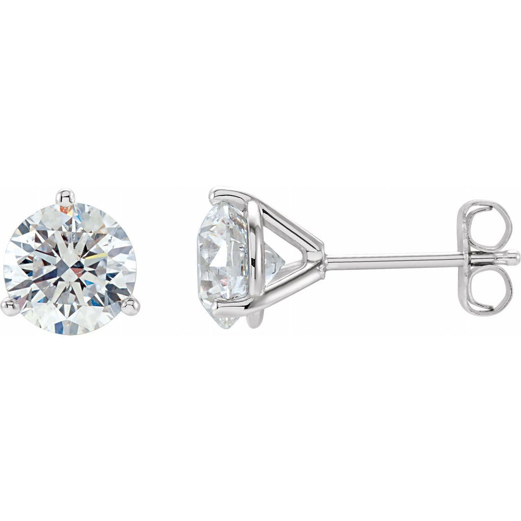 14kt white gold diamond studs earrings in a martini style setting with push backings. The two diamonds total 1 ctw and the diamonds are G-H color I1 clarity.