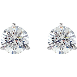 14kt white gold diamond studs earrings in a martini style setting with push backings. The two diamonds total 1 ctw and the diamonds are G-H color I1 clarity.