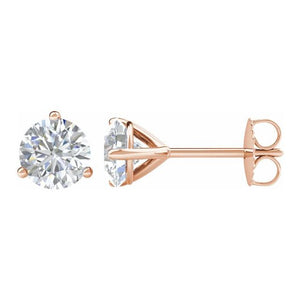 14kt rose gold diamond studs earrings in a martini style setting with push backings. The two diamonds total 1 ctw and the diamonds are G-H color I1 clarity.